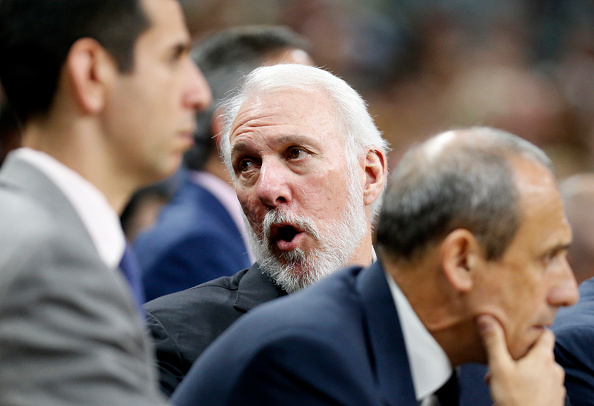 SAN ANTONIO,TX - APRIL 17: San Antonio head coach Gregg Popovic talks to his coaches during game against the Memphis Grizzlies in game one of the Western Conference Quarterfinals during the 2016 NBA Playoffs at AT&T Center on April 17, 2016 in San Antonio, Texas. NOTE TO USER: User expressly acknowledges and agrees that , by downloading and or using this photograph, User is consenting to the terms and conditions of the Getty Images License Agreement. (Photo by Ronald Cortes/Getty Images)