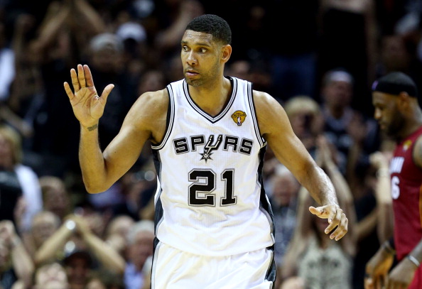 SAN ANTONIO, TX - JUNE 05:  Tim Duncan #21 of the San Antonio Spurs reacts after a basket against the Miami Heat during Game One of the 2014 NBA Finals at the AT&T Center on June 5, 2014 in San Antonio, Texas. NOTE TO USER: User expressly acknowledges and agrees that, by downloading and or using this photograph, User is consenting to the terms and conditions of the Getty Images License Agreement.  (Photo by Andy Lyons/Getty Images)
