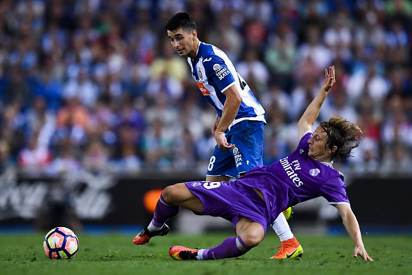 BARCELONA, SPAIN - SEPTEMBER 18: Luka Modric of Real Madrid CF competes for the ball with Marc Roca of RCD Espanyol during the La Liga match between RCD Espanyol and Real Madrid CF at the RCDE stadium on September 18, 2016 in Barcelona, Spain. (Photo by David Ramos/Getty Images)