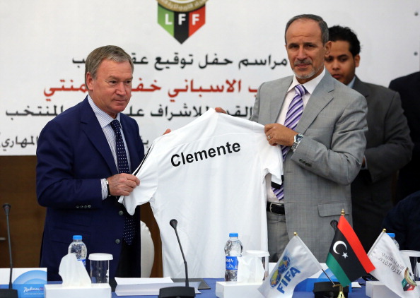 Spanish coach Javier Clemente (L) holds up a shirt with Anwar al-Techane, president of the Libyan Football association, after signing a contract overseeing the training of Libya's first national football team, in Tripoli, on October 12, 2013. AFP PHOTO/MAHMUD TURKIA (Photo credit should read MAHMUD TURKIA/AFP/Getty Images)