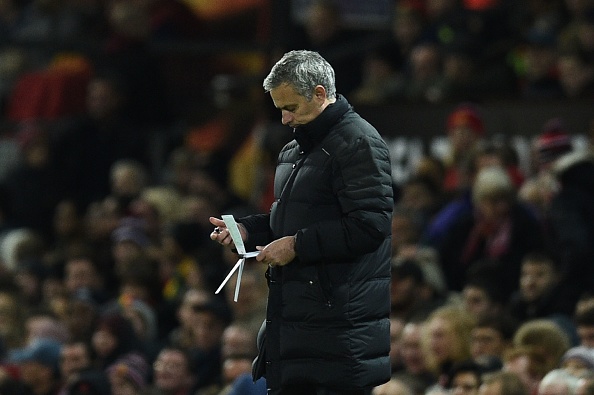 Manchester United's Portuguese manager Jose Mourinho checks his notes on the touchline during the UEFA Europa League group A football match between Manchester United and Feyenoord at Old Trafford stadium in Manchester, north-west England, on November 24, 2016. / AFP / Oli SCARFF (Photo credit should read OLI SCARFF/AFP/Getty Images)